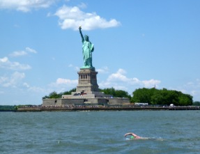 8 Bridges stage seven swimmer, Martin, swimming past the Statue of Liberty